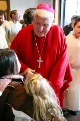 Archbishop Peter Leo Gerety, Archbishop Emeritus of Newark, shakes hands in 2007 with two children at Saint Catherine of Siena Parish in Cedar Grove. Pamela Suchy / NorthJersey.com