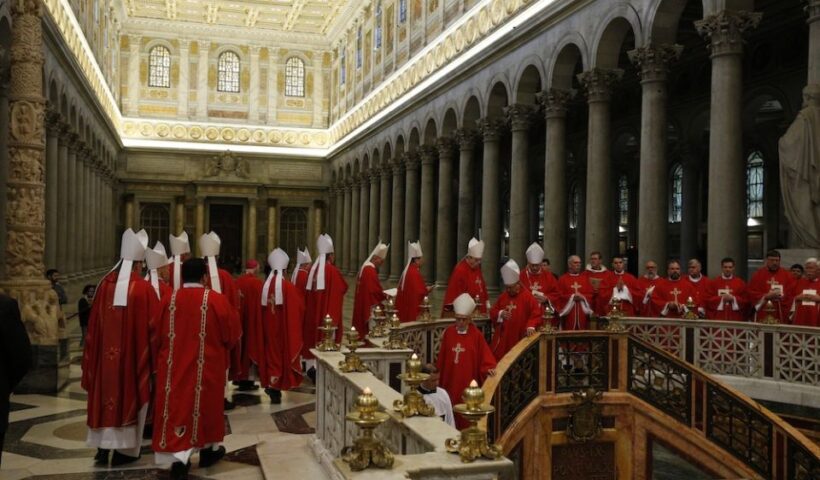 Bishops from Arizona, Colorado, New Mexico, Utah and Wyoming walk in procession to pray at the tomb of St. Paul after concelebrating Mass at the Basilica of St. Paul Outside the Walls in Rome Feb. 12, 2020, during their "ad limina" visits to the Vatican to report on the status of their dioceses. (CNS/Paul Haring)