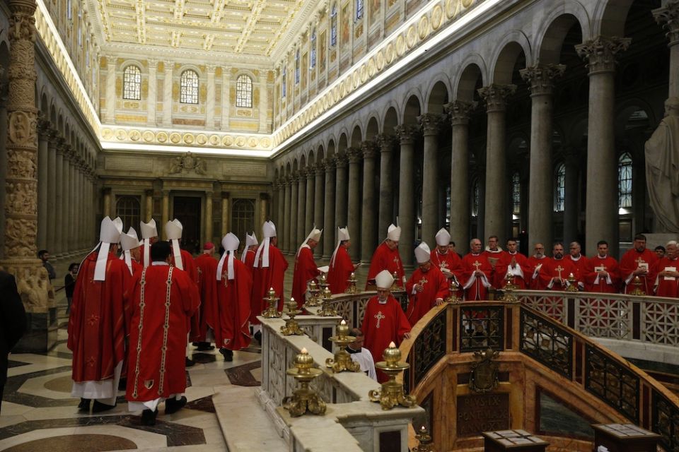 Bishops from Arizona, Colorado, New Mexico, Utah and Wyoming walk in procession to pray at the tomb of St. Paul after concelebrating Mass at the Basilica of St. Paul Outside the Walls in Rome Feb. 12, 2020, during their "ad limina" visits to the Vatican to report on the status of their dioceses. (CNS/Paul Haring)