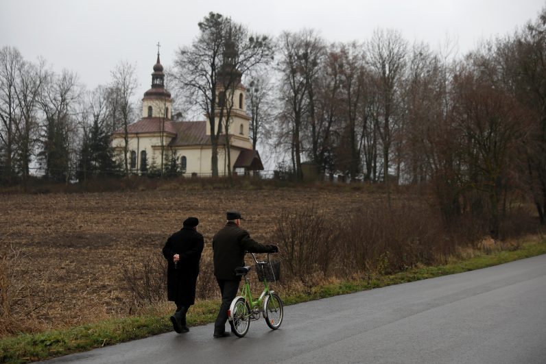 People are pictured in a file photo walking to Mass in Kalinowka, Poland. (CNS photo/Kacper Pempel, Reuters)