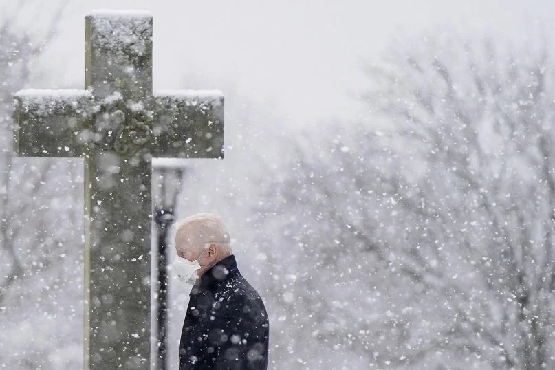 President Joe Biden departs after attending Mass at St. Joseph on the Brandywine Catholic Church as snow falls, Feb. 7, 2021, in Wilmington, Delaware. (AP Photo/Patrick Semansky)