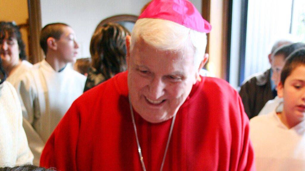 Archbishop Peter Leo Gerety, Archbishop Emeritus of Newark, shakes hands in 2007 with two children at Saint Catherine of Siena Parish in Cedar Grove. (Reuters)