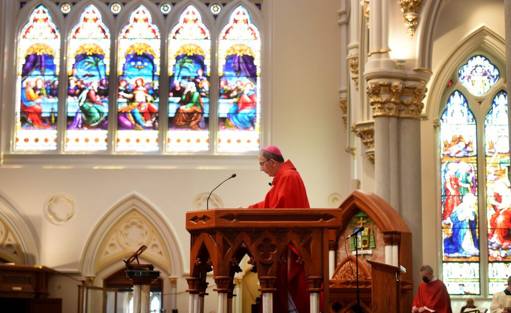 Erie Catholic Bishop Lawrence Persico leads a Good Friday service on April 2 at St. Peter Cathedral in Erie, the mother church of the 13-county Catholic Diocese of Erie.  Jack Hanrahan / Erie Times-News
