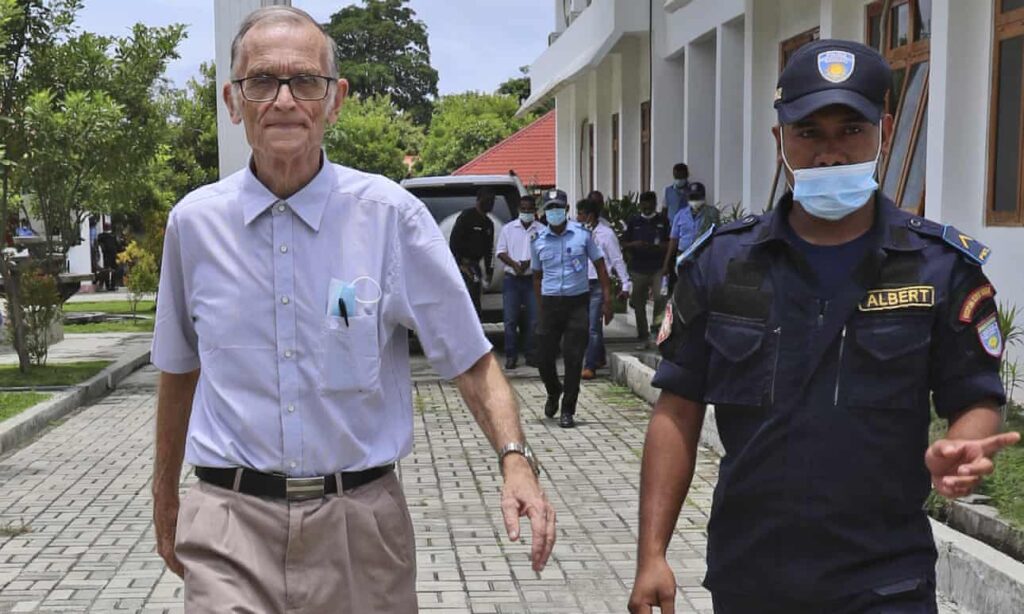 A police officer escorts Richard Daschbach into court in Oecusse, Timor-Leste, in February. The former Catholic priest faces 14 counts of child sexual abuse. Photograph: Raimundos Oki / AP