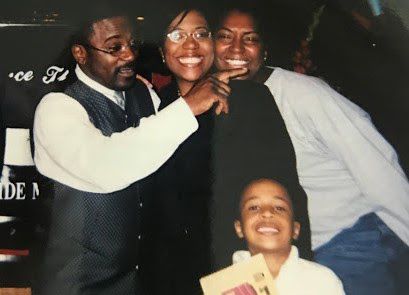 Marcus Bell Jr. (front) and his mother, Donna Fields (center), in a photo from about 2003 with Pastor Rickie Rush and a friend. Fields says Rush tried to position himself as a father figure to her and her sister before he sexually abused them.(Courtesy of Donna Fields)