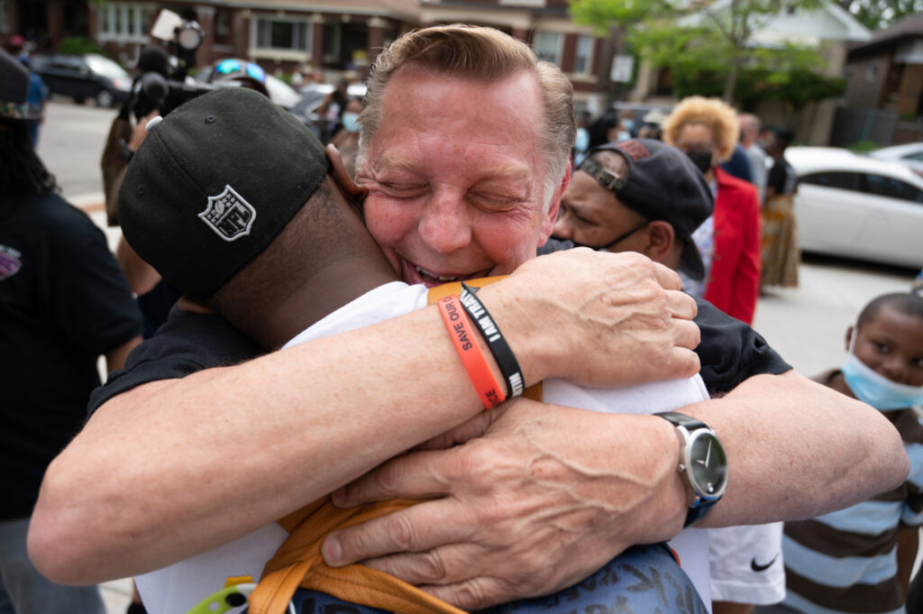 Credit: Colin Boyle/Block Club Chicago Father Michael Pfleger embraces a supporter at St. Sabina Church on May 24, 2021. Earlier in the day, the Archdiocese reinstated the popular pastor after a five-month-long investigation into sexual abuse allegations.