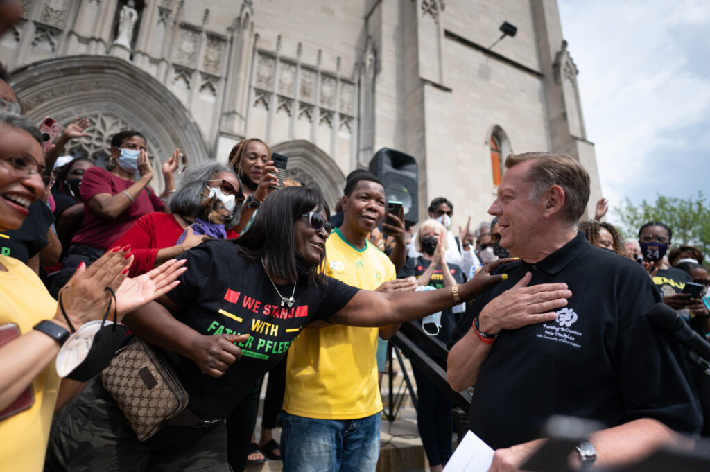 Credit: Colin Boyle/Block Club Chicago Father Michael Pfleger is greeted by supporters at St. Sabina Church on May 24, 2021. Earlier in the day, the Archdiocese reinstated the popular pastor after a five-month-long investigation into sexual abuse allegations.