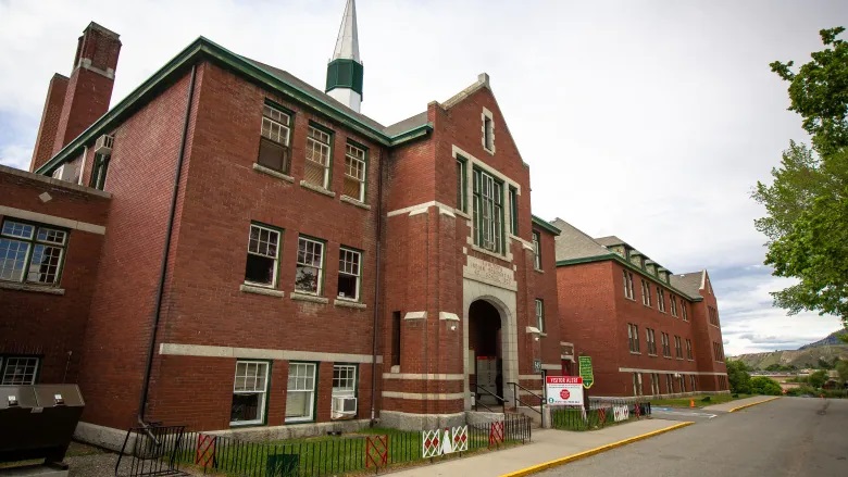 The former Kamloops Indian Residential School is seen on Tk’emlups te Secwépemc First Nation in Kamloops, B.C., on May 27, 2021. The remains of 215 children have been found buried on the site, the First Nation said. (Andrew Snucins/The Canadian Press)