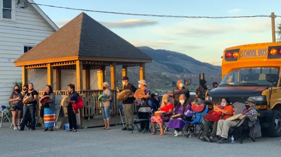 About 100 people gathered at the site of the former Kamloops residential school on Saturday night to grieve and honour the 215 children whose bodies were discovered last week. (Briar Stewart / CBC)