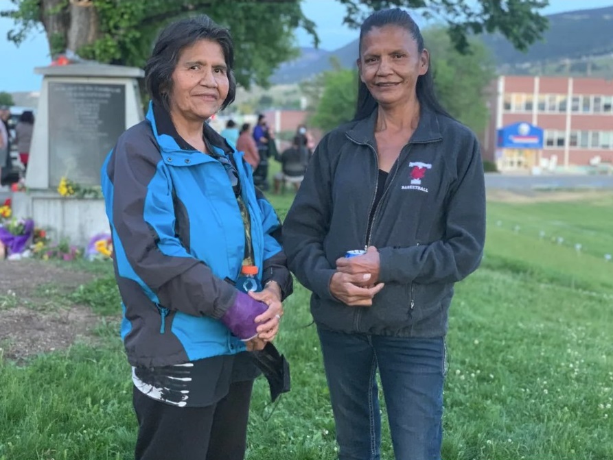 Marie Narcisse, left, and her sister were among the crowd at the site of the Kamloops residential school on Saturday evening. (Briar Stewart / CBC)