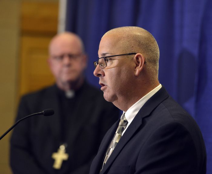 Doug Cole, a survivor of clergy abuse, speaks at a press conference at the Bishop Marshall Center in Springfield called to discuss the release of 40 names added to the list of sexual abusers, June 2, 2021. The Most Rev. William D. Byrne, bishop of the Roman Catholic Diocese of Springfield listens. (Don Treeger / The Republican)