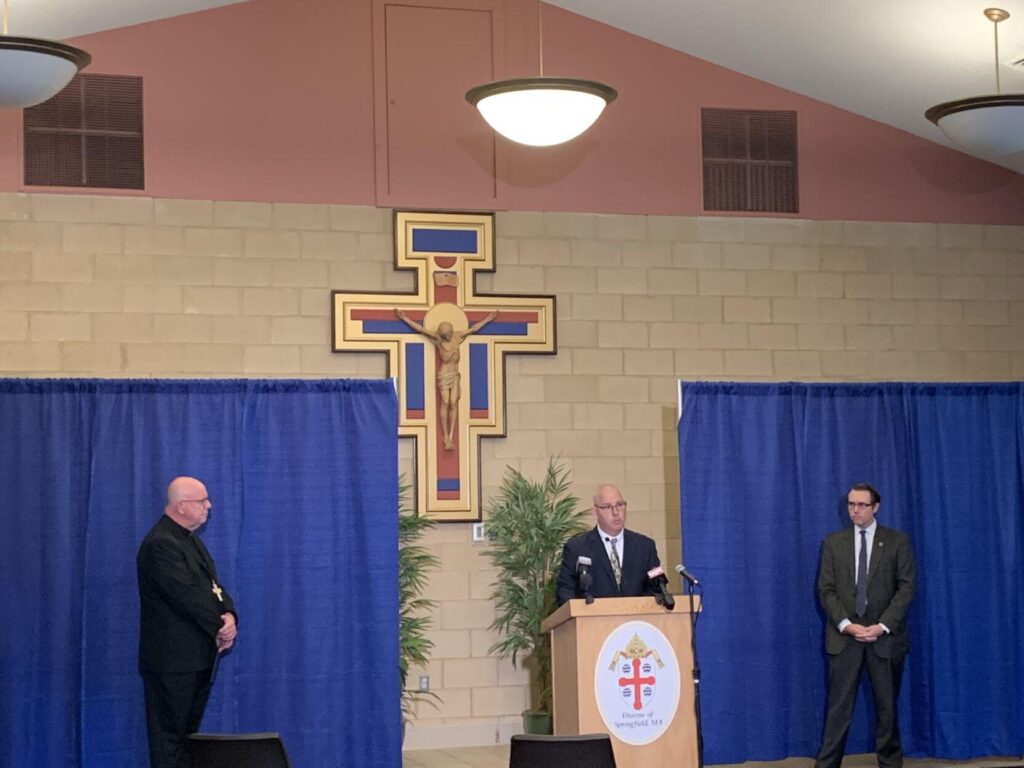 Doug Cole, center, a survivor of sexual abuse, speaks during a Wednesday news conference, flanked by Bishop William Byrne, left, and Jeffrey Trant, director of Safe Environment and Victim Assistance. Byrne and Trant announced that the Diocese of Springfield now will list 61 individuals as credibly accused of sexual abuse while associated with the diocese.  Danny Jin — The Berkshire Eagle