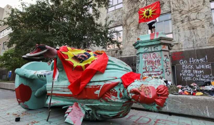 A toppled and defaced statue of Egerton Ryerson, considered an architect of Canada's residential Indigenous school system, following a protest at Ryerson University in Toronto on June 6. (Chris Helgren/Reuters)