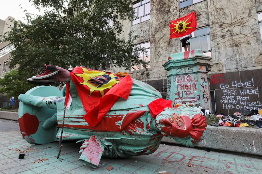 A toppled and defaced statue of Egerton Ryerson, considered an architect of Canada's residential Indigenous school system, following a protest at Ryerson University in Toronto on June 6. (Chris Helgren/Reuters)