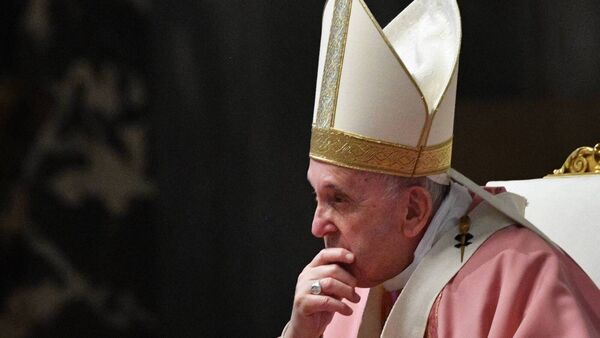 Pope Francis listens to Cardinal Luis Antonio Tagle during a Mass to mark 500 years of Christianity in the Philippines at St Peter's Basilica in the Vatican. Picture: Tiziana Fabi/Pool/AFP via Getty Images