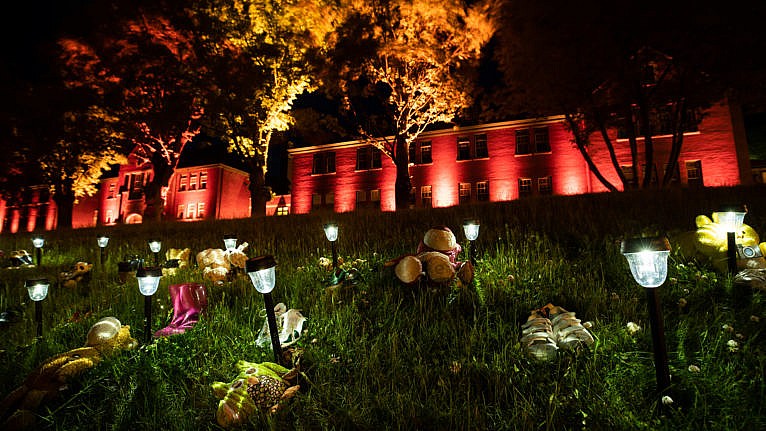 Shoes are placed on the lawn outside the former Kamloops Indian Residential School on June 4, 2021 (Darryl Dyck/CP)