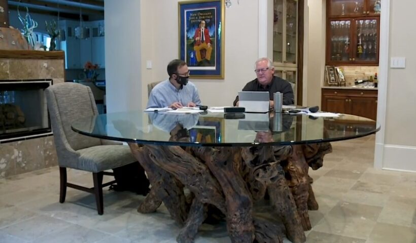 Reporter Mike Hammer and Mike Brandner Sr., brother of Scot Brandner, discuss Fr. Brian Highfill. Still from video report.