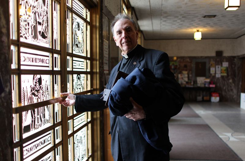 The Rev. Daniel McCarthy exits St. Tarcissus Catholic Church on Feb. 24, 2012. (Abel Uribe / Chicago Tribune)