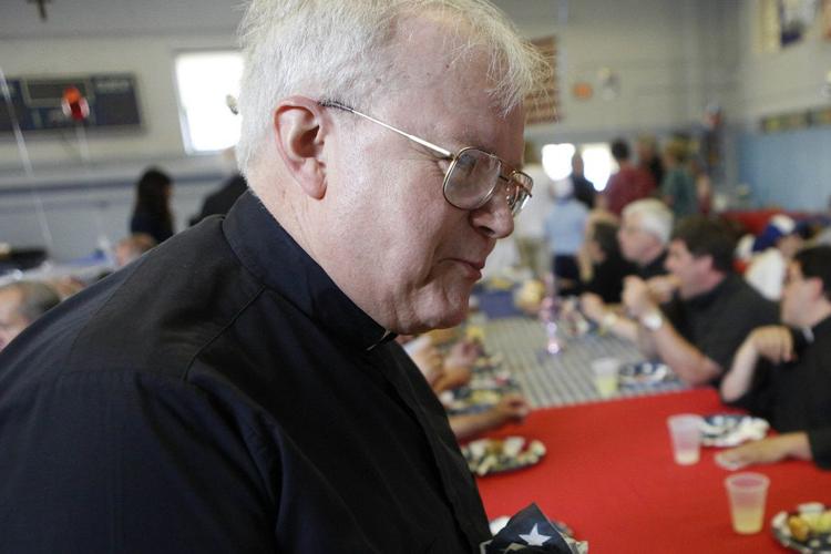 The Rev. Louis Dolinic at a celebration of "the year of the priest" in the Mary Queen of Angels Regional Catholic School cafeteria on June 3, 2010.  Derek Gee