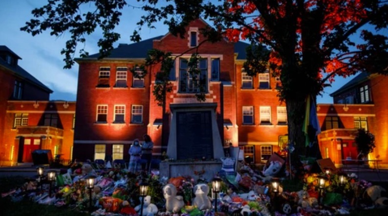 A memorial at the former Kamloops Indian Residential School to honour the 215 children whose remains were discovered  (Photo by Cole Burston / AFP via Getty Images)