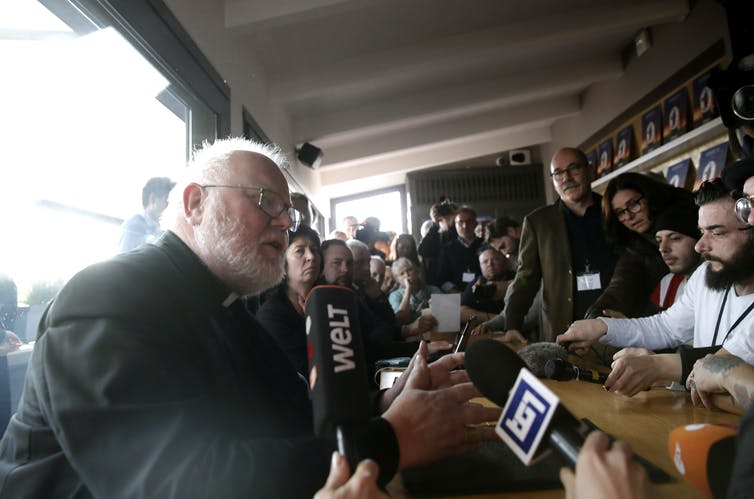 Cardinal Reinhard Marx, left, in Rome, meets with members of Ending Clergy Abuse in 2019. (AP Photo / Alessandra Tarantino)
