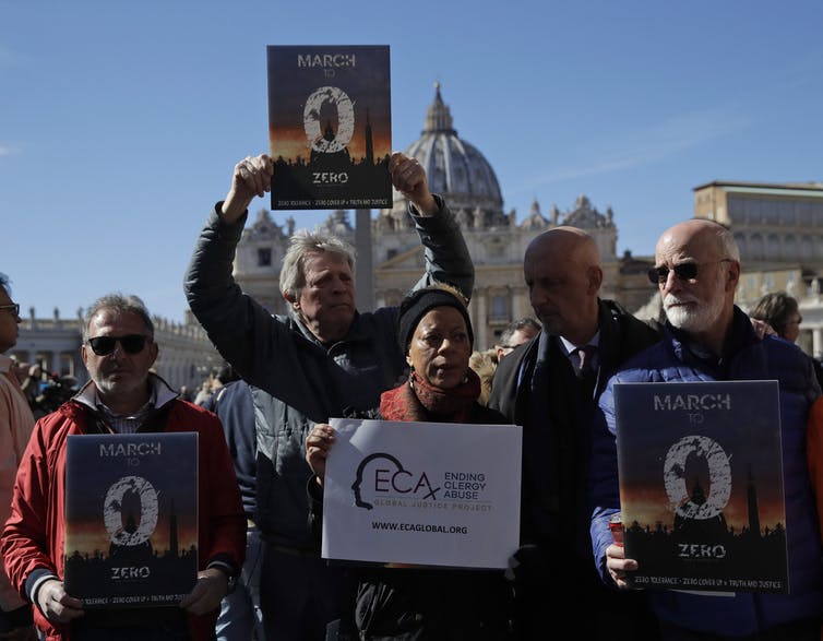 Members of Ending Clergy Abuse, a global advocacy network, stand in front of St. Peter’s Square at the Vatican in 2019. (AP Photo / Alessandra Tarantino)