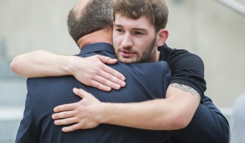 Oliver Peyton hugs his father Scott following a sentencing hearing for former priest Michael Guidry Tuesday, April 30, 2019, at the St. Landry Parish Courthouse in Opelousas, La. Advocate staff photo by Leslie Westbrook