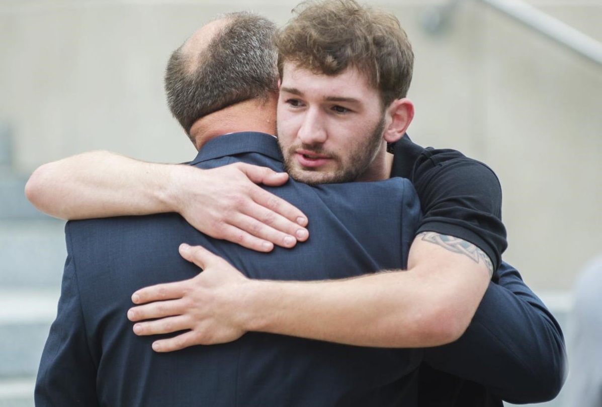 Oliver Peyton hugs his father Scott following a sentencing hearing for former priest Michael Guidry Tuesday, April 30, 2019, at the St. Landry Parish Courthouse in Opelousas, La. Advocate staff photo by Leslie Westbrook