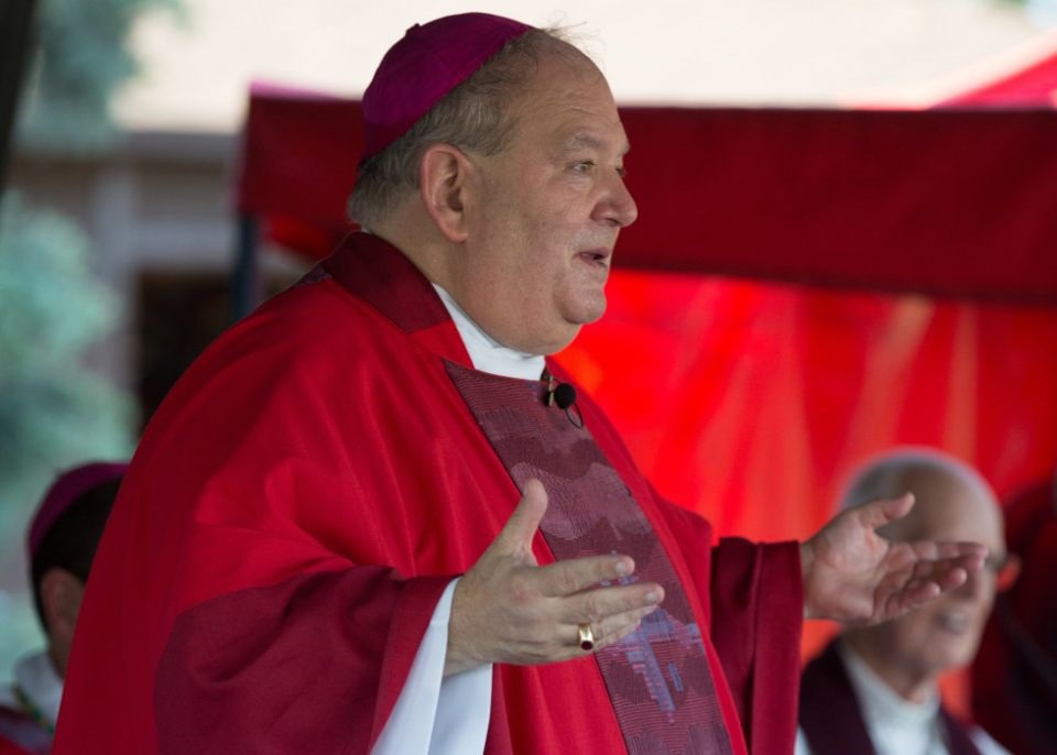 Archbishop Bernard A. Hebda of St. Paul and Minneapolis addresses those gathered for an outdoor Mass on the vigil of Pentecost at St. Bonaventure in Bloomington, Minn., May 22, 2021. (CNS/The Catholic Spirit/Dave Hrbacek)