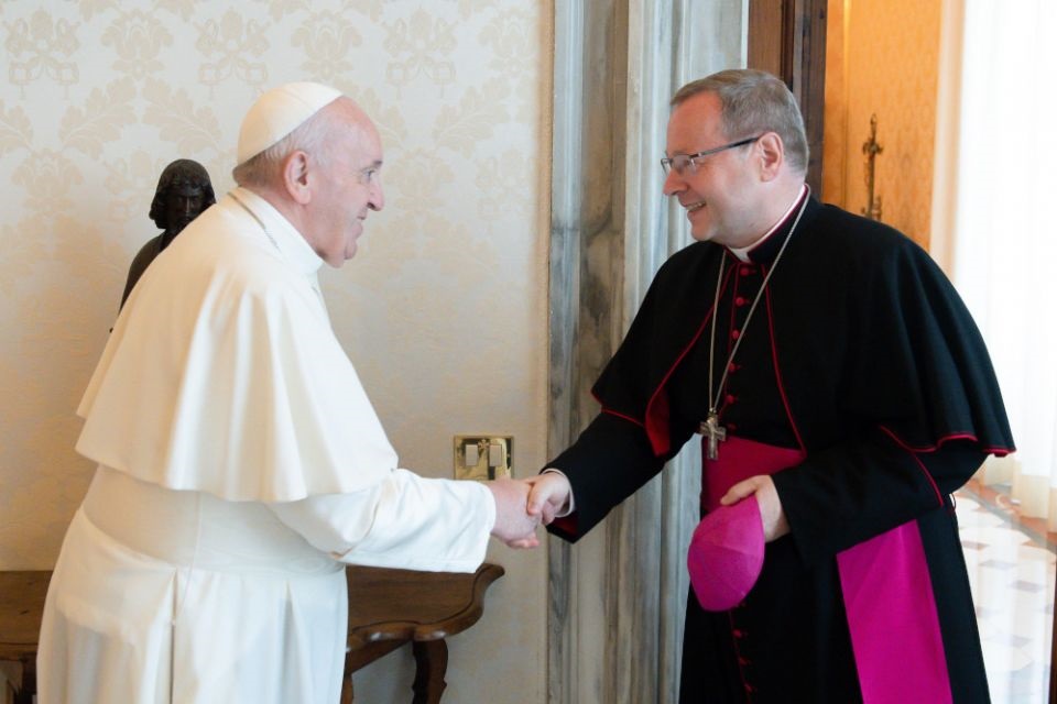 Pope Francis greets Bishop Georg Bätzing, president of the German bishops' conference, during an audience at the Vatican June 24, 2021. Bätzing said he assured the pope that German Catholics do not want to split from the church. (CNS/Vatican Media)