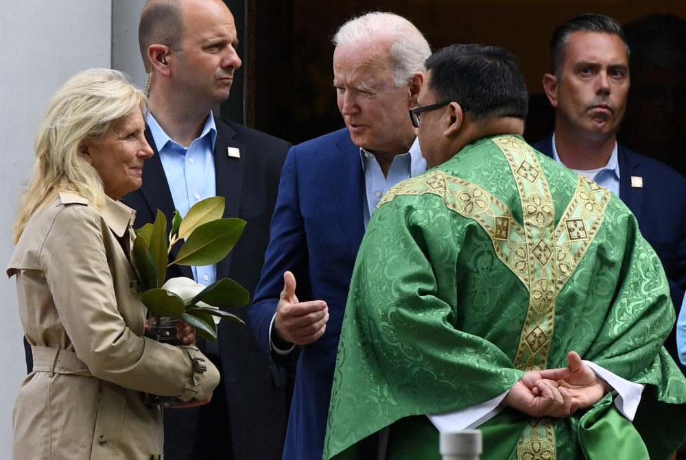 US President Joe Biden (C) and First Lady Jill Biden (L) speaks with a priest as they leave St. Joseph on the Brandywine Catholic Church in Wilmington, Delaware, June 19, 2021. U.S. Roman Catholic bishops issued a challenge on June 18 to President Biden over his support for abortion rights, agreeing to draft a statement on the meaning of holy communion which could potentially be used to deny the sacred rite to the U.S. leader. (Olivier DOULIERY/AFP via Getty Images)