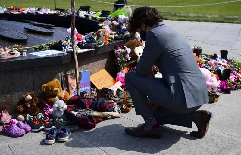 Canadian Prime Minister Justin Trudeau visits a memorial at the Eternal Flame on Parliament Hill in Ottawa on Tuesday, June 1, 2021, that's in recognition of discovery of children's remains at the site of a former residential school in Kamloops, British Columbia. (Sean Kilpatrick/The Canadian Press via AP)Canadian Prime Minister Justin Trudeau visits a memorial at the Eternal Flame on Parliament Hill in Ottawa on Tuesday, June 1, 2021, that's in recognition of discovery of children's remains at the site of a former residential school in Kamloops, British Columbia. (Sean Kilpatrick/The Canadian Press via AP)