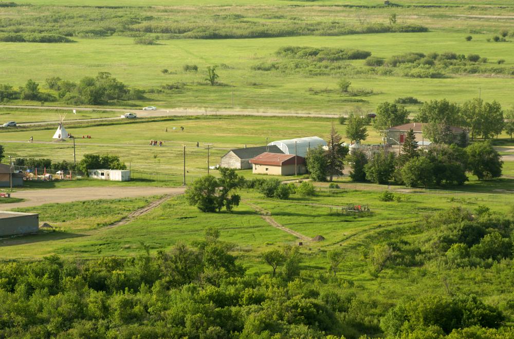 A view of the site where ground-penetrating radar recorded hits of what are believed to be 751 unmarked graves near the grounds of the former Marieval Indian Residential School on the Cowessess First Nation, Saskatchewan, Saturday, June 26, 2021. (Mark Taylor/The Canadian Press via AP)