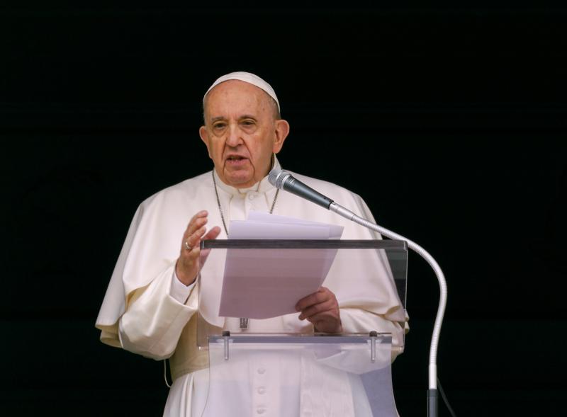 FILE - In this June 6, 2021 file photo, Pope Francis speaks from the window of his studio overlooking St. Peter's Square at the Vatican to a crowd of faithful and pilgrims gathered for the Sunday Angelus noon prayer. On Wednesday, June 30, 2021 Canada’s Catholic bishops said Pope Francis has agreed to meet in December with Indigenous survivors of the country’s notorious residential schools amid calls for a papal apology for Catholic Church’s role in the abuse and deaths of thousands of native children. (AP Photo/Domenico Stinellis, file)