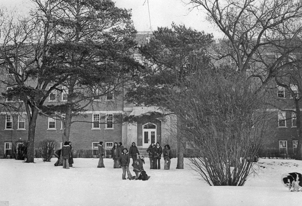 A group of students in front of the Fort Qu'Appelle Indian Residential School in Lebret, Sask., in March 1973. Photo via Library and Archives Canada