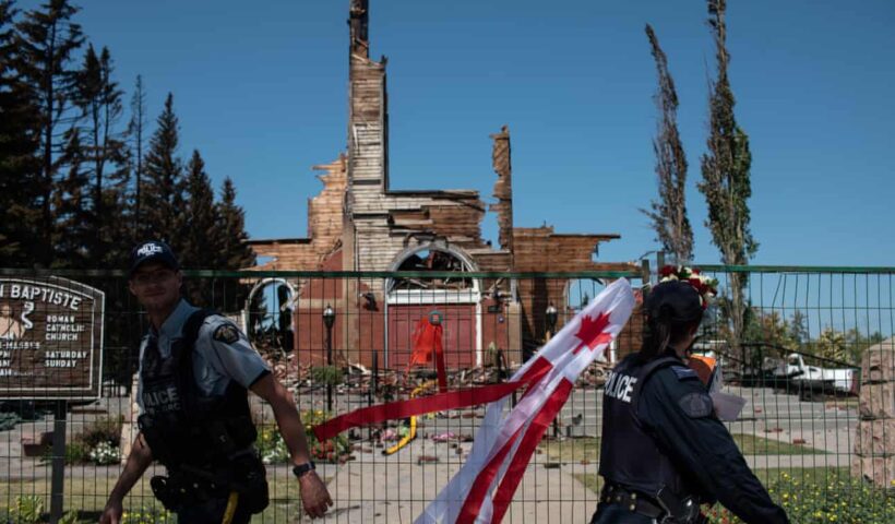 Firefighters inspect the damage at the burned-out Roman Catholic St Jean Baptiste church in Morinville, Alberta, Canada. Photograph: Anadolu Agency / Getty Images