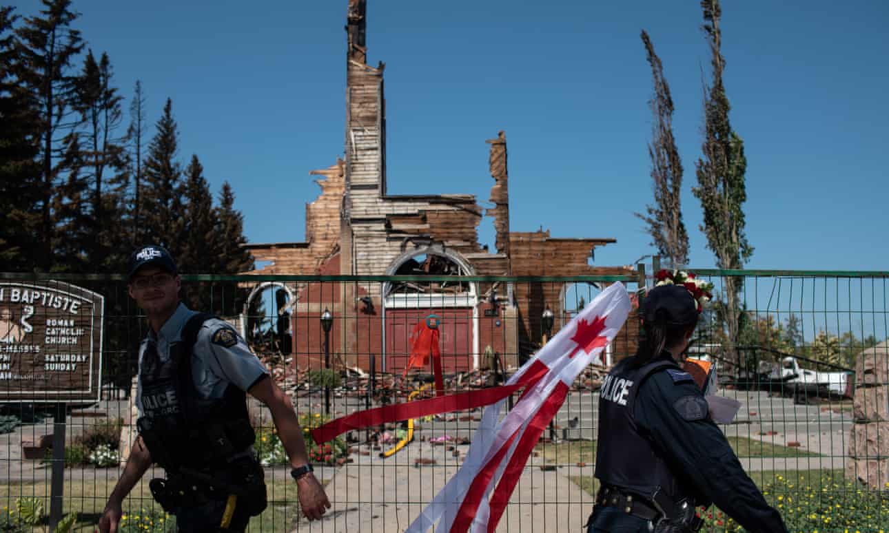 Firefighters inspect the damage at the burned-out Roman Catholic St Jean Baptiste church in Morinville, Alberta, Canada. Photograph: Anadolu Agency / Getty Images