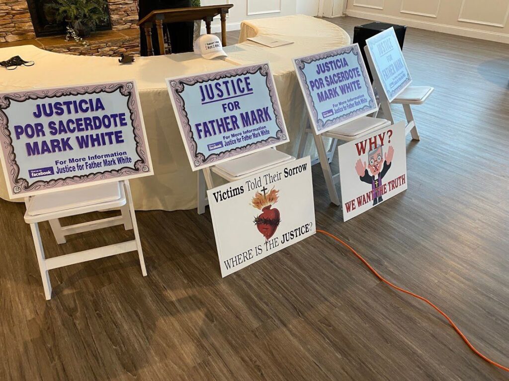 Signs supporting Father Mark White were on display.  Bill Wyatt