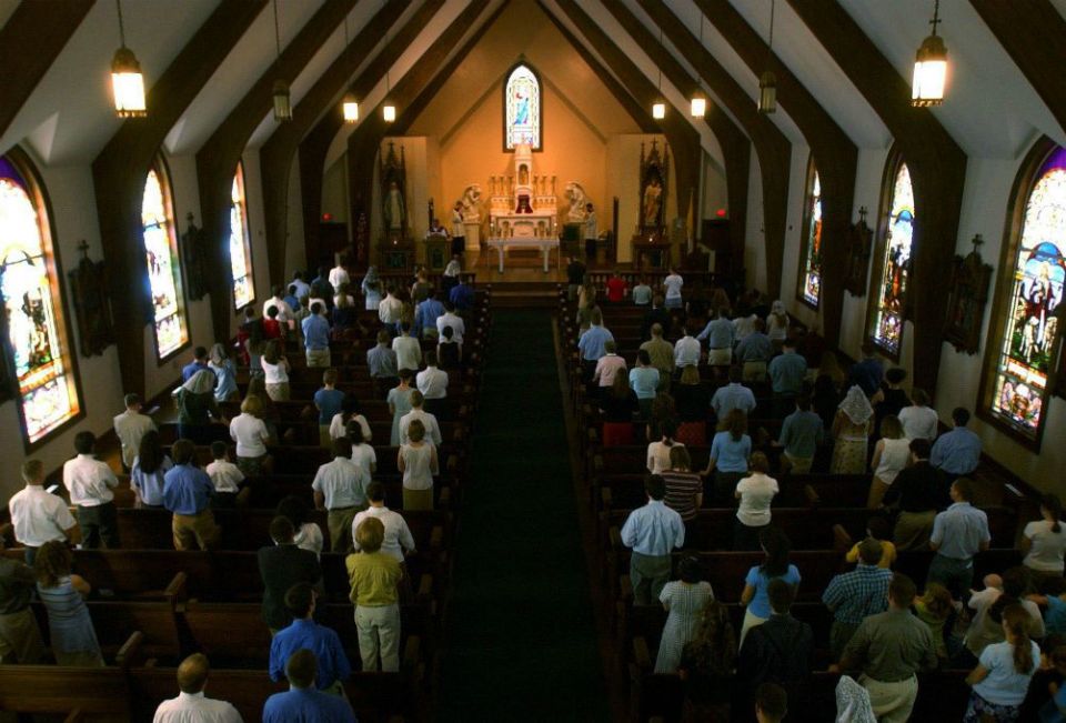 People attend Mass at Christendom College in Front Royal, Virginia, April 3, 2003. (Newscom/The Washington Times/ZUMAPRESS.com)