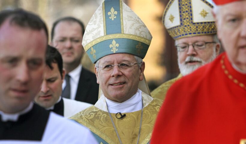 In this Dec. 8, 2011 file photo, Bishop Peter Libasci, center, arrives at the Cathedral of St. Joseph for his Installation service as the Tenth Bishop of the Diocese of Manchester, in Manchester, N.H. A lawsuit is accusing Libasci of sexually abusing a teenager when he was a priest in New York.JIM COLE/ASSOCIATED PRESS