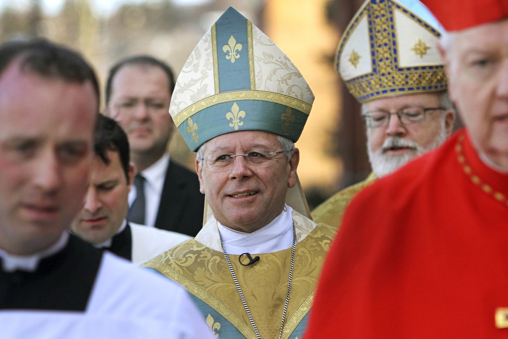 In this Dec. 8, 2011 file photo, Bishop Peter Libasci, center, arrives at the Cathedral of St. Joseph for his Installation service as the Tenth Bishop of the Diocese of Manchester, in Manchester, N.H. A lawsuit is accusing Libasci of sexually abusing a teenager when he was a priest in New York.JIM COLE/ASSOCIATED PRESS