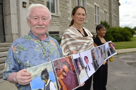 Residential school survivor Piita Irniq, human rights advocate Lieve Halsberghe and supporter Susie Utatnaaq stand before the Oblate-owned home in Ottawa in 2016 to protest the Oblate order’s 200th anniversary that year. (File photo by Jim Bell)