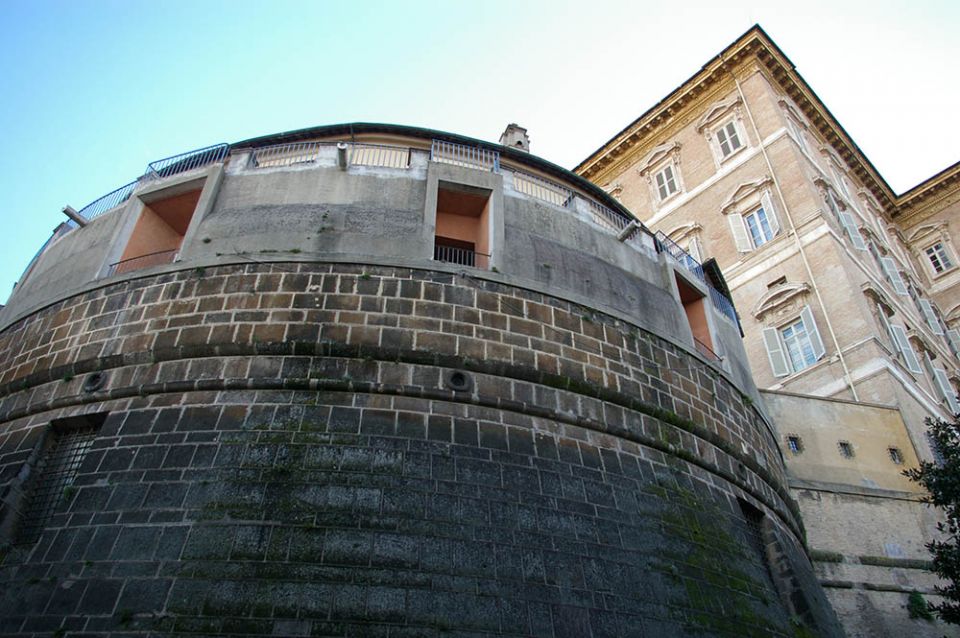 The headquarters of the Institute for the Works of Religion, commonly known as the Vatican bank, with the Apostolic Palace in background (NCR photo / Joshua J. McElwee)