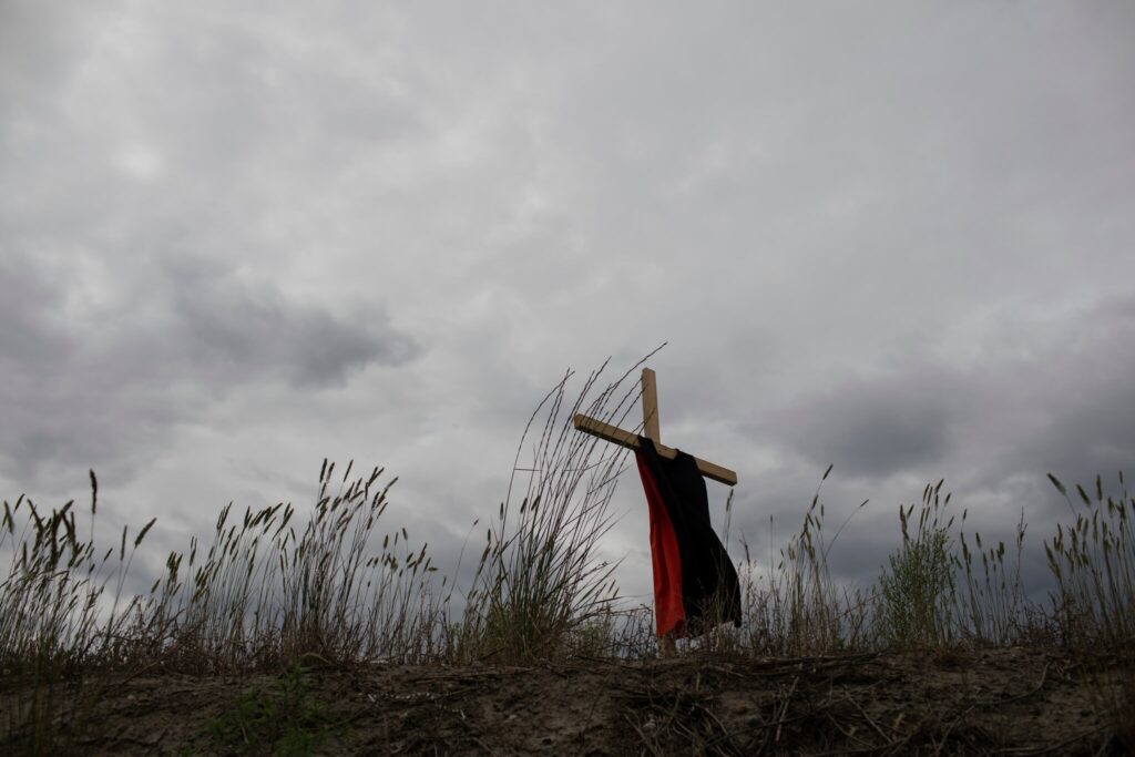 This dress hanging on a cross represents the children who died at the Kamloops Indian Residential School. Amber Bracken for The New York Times