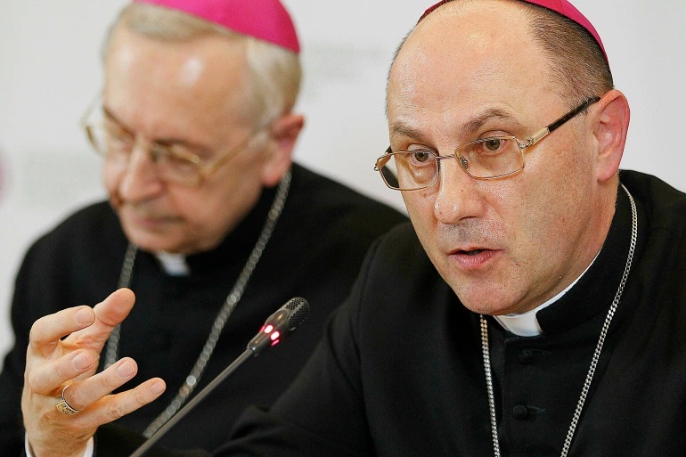 The head of Poland's Catholic Church Archbishop Wojciech Polak, right, addresses the media during a news conference in Warsaw, Poland in March 2019. Archbishop Wojciech Polak apologised to survivors of sexual abuse at the hands of Catholic Church clergy and asked for forgiveness [File: Czarek Sokolowski/AP Photo]