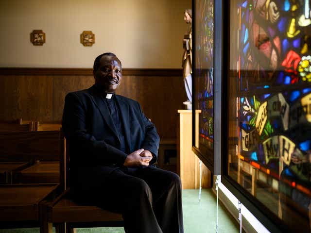 Father Wilbroad Mwape, the pastor and administrator of St. Anthony of Padua Catholic Church, poses for a portrait in the school chapel Thursday, Aug. 6, 2020. (Josh Morgan / Staff)