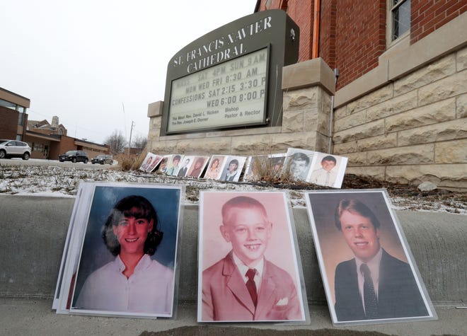 Photos of sexual abuse victims  were displayed in front of St. Francis Xavier Cathedral during a Jan. 18 press conference at which  Survivors Network for those Abused by Priests called on state Attorney General Josh Kaul to investigate the diocese's handling of allegations against its priests.