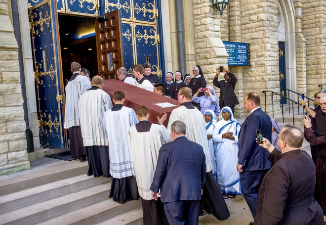 The casket bearing the remains of Archbishop Fulton Sheen is carried into St. Mary's Cathedral in Peoria on Thursday, June 27, 2019, completing the transfer that began before dawn at St. Patrick's Cathedral in New York. - Journal Star File Photo