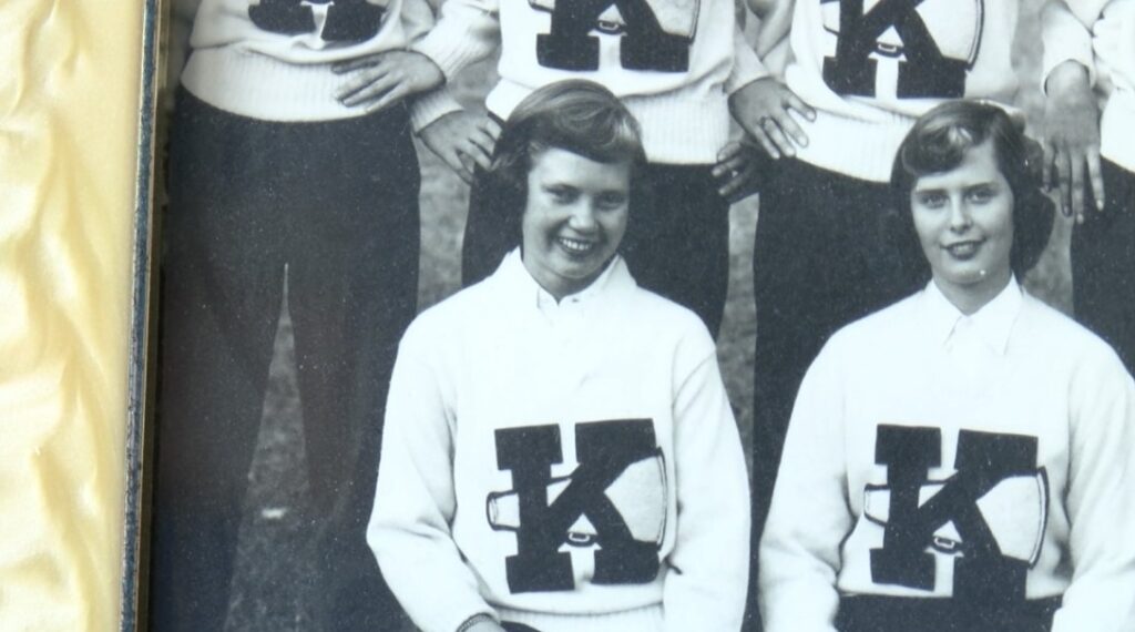 Sue Lauber-Fleming (left) with her high school cheerleading team.