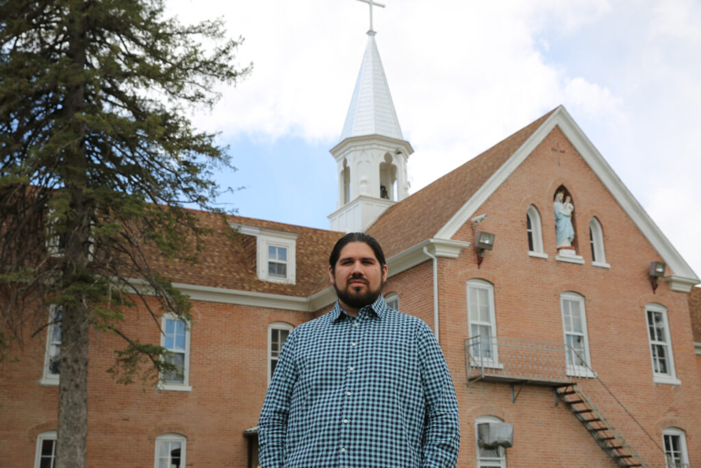 Maka Black Elk, the Red Cloud Indian School executive director for truth and healing, pictured on the school's campus (Credit: Marcus Fast Wolf/Red Cloud Indian School.)